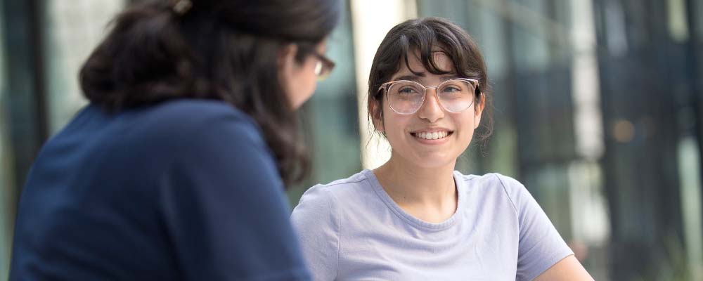 A student talks with an advisor