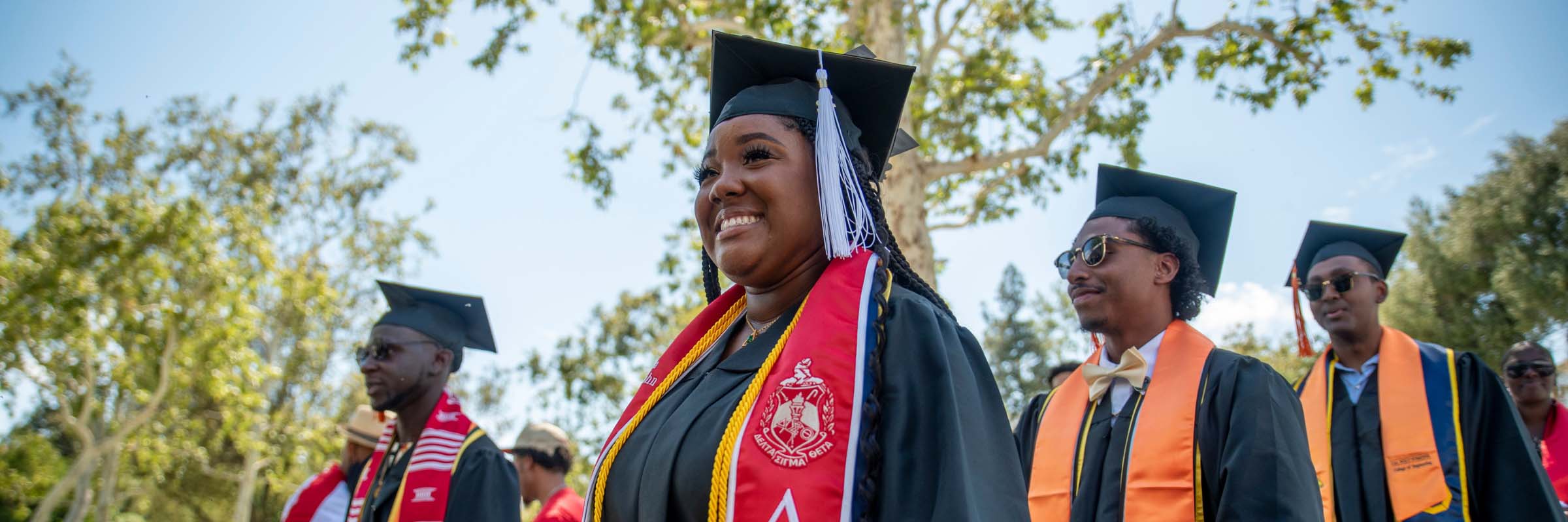 Students smile at their graduation