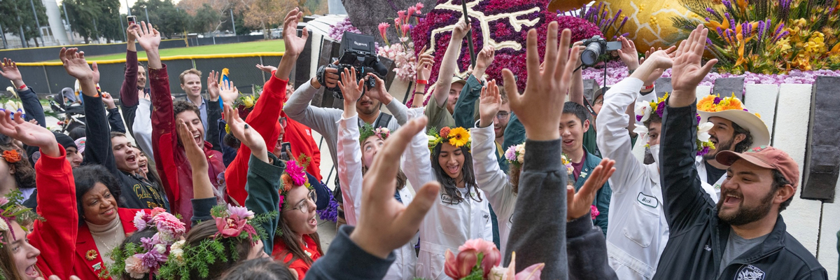 Students pose in front of their float