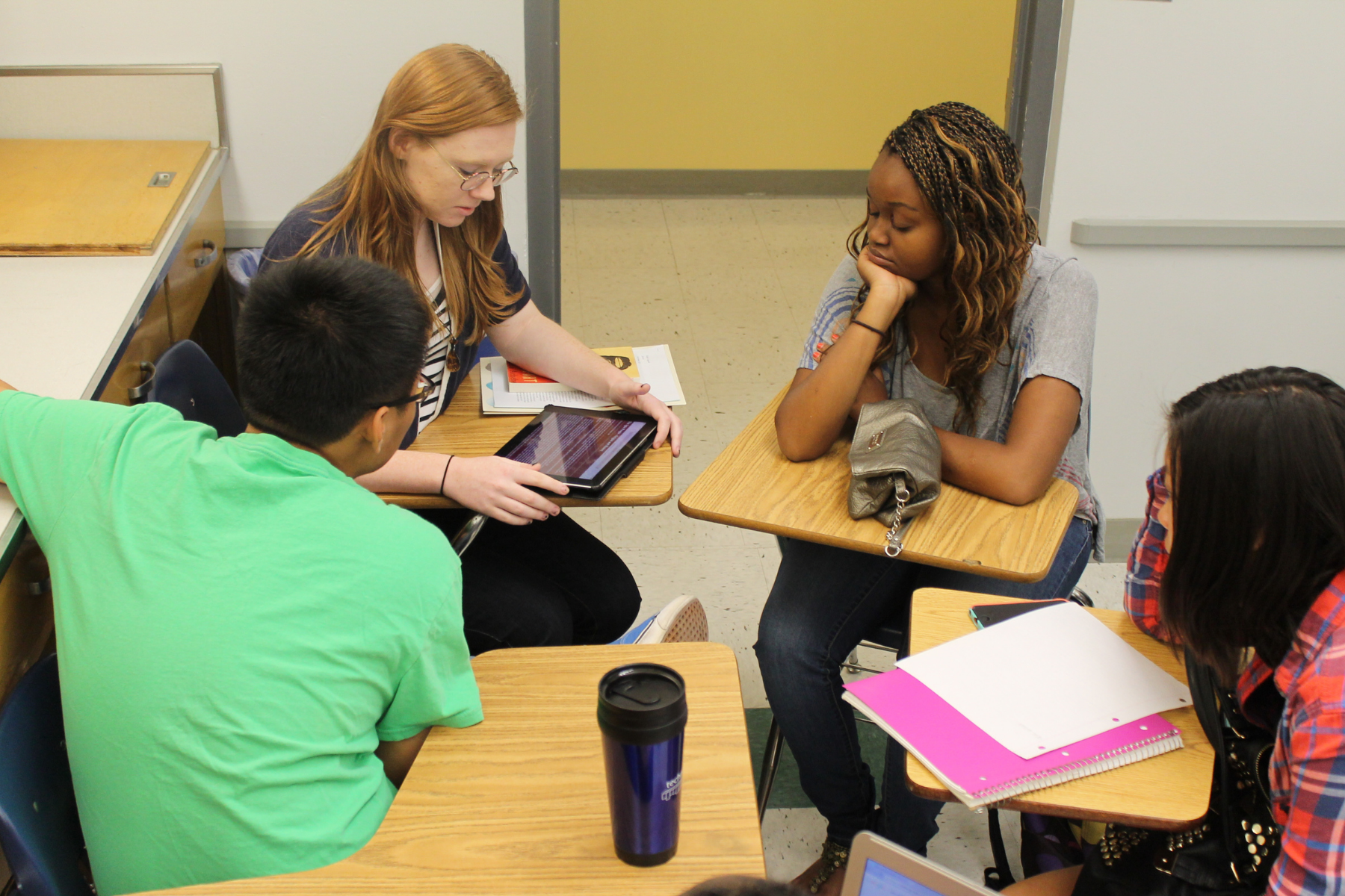 four student forming a group and working together
