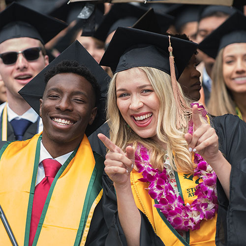 graduating students smiling