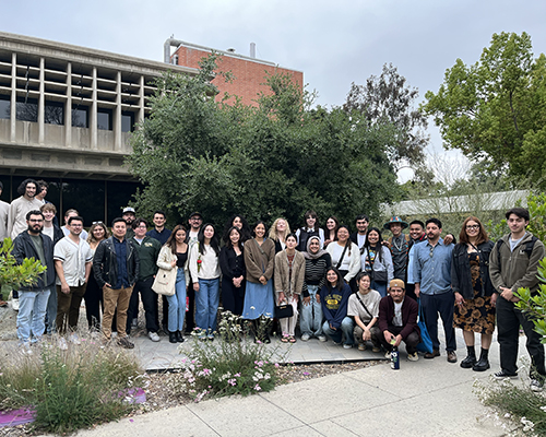 BSLA graduates pose in front of Building 7