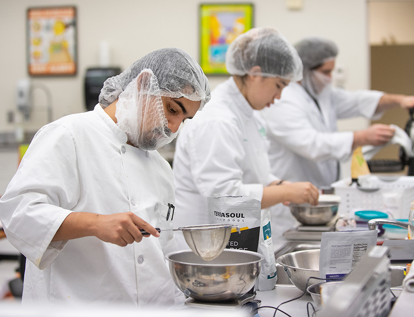 Students in product development class measure food
